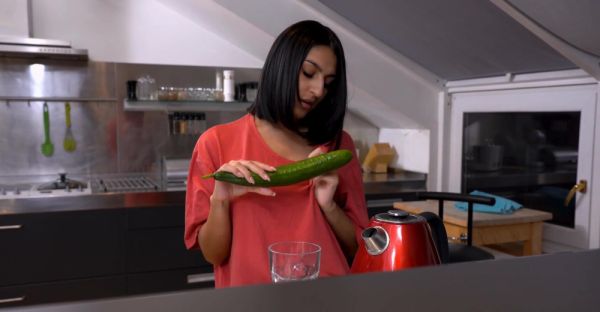 A cute girl peels a cucumber for her older man in a sensual scene. - alphaporno.com on freevids.org