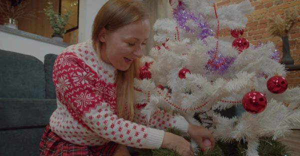 MILF in miniskirt rocks Santa hat while pleasuring herself with a festive dildo on the couch - alphaporno.com on freevids.org